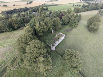 Oblique aerial view of Dowhill Castle looking ENE.