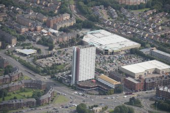 Oblique aerial view of Anniesland Court, looking E.