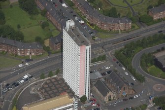 Oblique aerial view of Anniesland Court, looking NW.