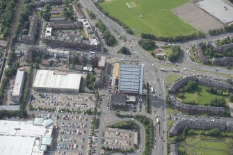 Oblique aerial view of Anniesland Court, looking SSW.