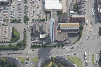 Oblique aerial view of Anniesland Court, looking SE.