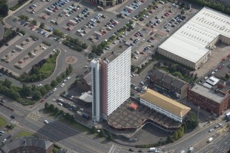 Oblique aerial view of Anniesland Court, looking E.