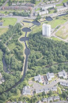 Oblique aerial view of the Kelvin Aqueduct and Maryhill Locks, looking ENE.