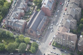 Oblique aerial view of Hyndland Parish Church, looking S.