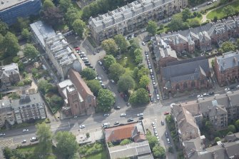Oblique aerial view of Hyndland Parish Church and St Bride's Episcopal Church, looking ESE.