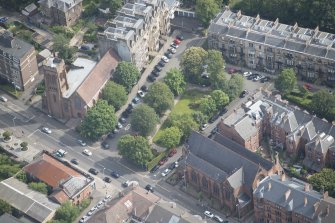 Oblique aerial view of Hyndland Parish Church and St Bride's Episcopal Church, looking ENE.