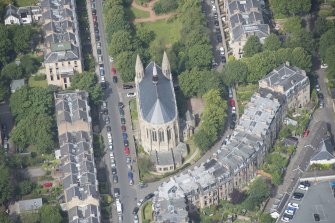 Oblique aerial view of Grosvenor Terrace and Kelvinside Hillhead Parish Church, looking NW.