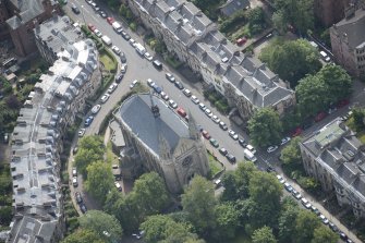 Oblique aerial view of Grosvenor Terrace and Kelvinside Hillhead Parish Church, looking SSE.