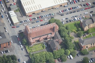 Oblique aerial view of the St Columba's Roman Catholic Church, looking E.