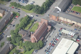 Oblique aerial view of the St Columba's Roman Catholic Church, looking WNW.