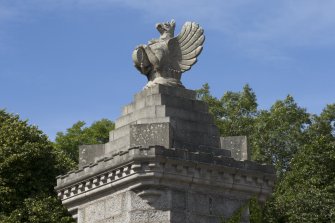 Detail of carved griffin on gate pillar.