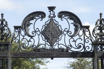 Decorative panel above gates from west.