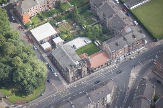 Oblique aerial view of St Andrew's East Church and Church Hall, looking NE.