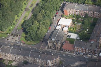 Oblique aerial view of St Andrew's East Church and Church Hall, looking N.