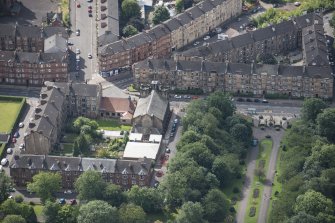 Oblique aerial view of St Andrew's East Church and Church Hall, looking S.