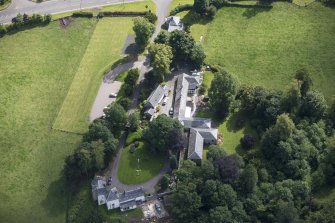 Oblique aerial view of Peel Lodge, Tower House and Stables, looking SE.