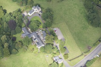 Oblique aerial view of Peel Lodge, Tower House and Stables, looking NW.