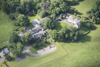 Oblique aerial view of Peel Lodge, Tower House and Stables, looking WSW.