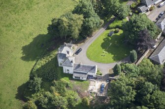 Oblique aerial view of Peel Tower House, looking E.