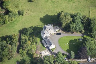 Oblique aerial view of Peel Tower House, looking NE.
