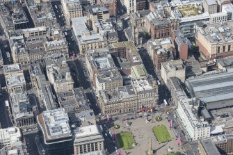 Oblique aerial view of St Vincent Place, George Square, West George Street and St George's Tron Parish Church, looking WNW.