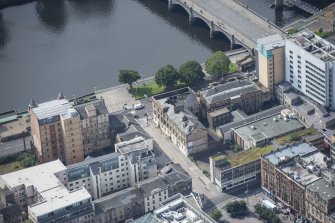 Oblique aerial view of Cooper's Warehouse and Custom House, looking SW.