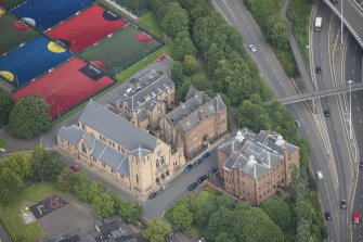 Oblique aerial view of St Mungo's Roman Catholic Church and Martyrs' Public School, looking NE.