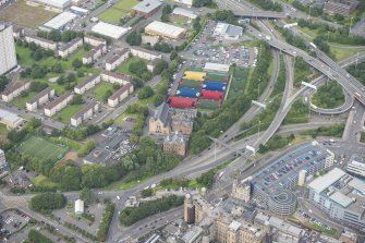 Oblique aerial view of St Mungo's Roman Catholic Church and Martyrs' Public School, looking NNW.