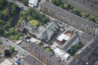 Oblique aerial view of St Anne's Roman Catholic Church and Presbytery, looking WSW.