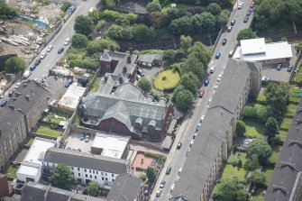 Oblique aerial view of St Anne's Roman Catholic Church and Presbytery, looking SSE.