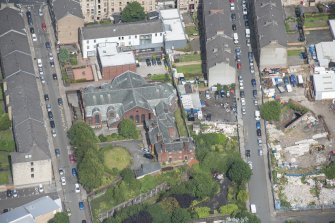 Oblique aerial view of St Anne's Roman Catholic Church and Presbytery, looking NNE.