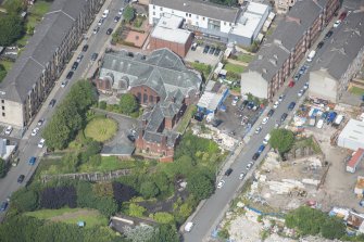 Oblique aerial view of St Anne's Roman Catholic Church and Presbytery, looking NNW.