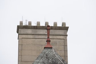 Detail of finial and chimney stack on the south elevation.