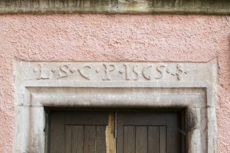 Detail of date stone above east facing doorway.