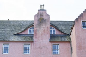 Detail of east facing shiminey stack and windows.