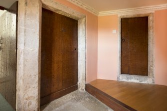 Interior. Detail of studded doors on top landing.