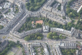 Oblique aerial view of Bellevue Crescent, St Mary's Parish Church, Northumberland Place and Drummond Place, looking SW.