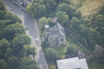 Oblique aerial view of Greenside Parish Church, looking SE.