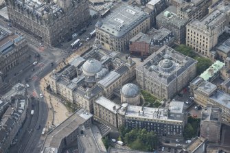 Oblique aerial view of New Register House, General Register House and Circular Record Hall, looking SSW.