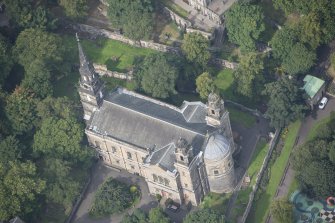 Oblique aerial view of St Cuthbert's Church, looking NNW.