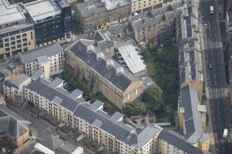 Oblique aerial view of the Church of the Sacred Heart, looking E.