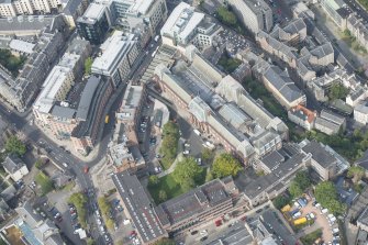 Oblique aerial view of Edinburgh College of Art and Edinburgh Fire Brigade Station, looking NW.
