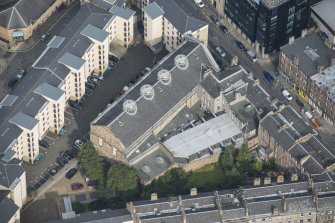 Oblique aerial view of the Church of the Sacred Heart, looking N.