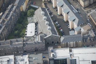 Oblique aerial view of the Church of the Sacred Heart, looking SSW.