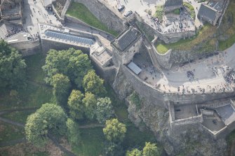 Oblique aerial view of Edinburgh Castle centred on the Portcullis Gate and Argyle Tower,  looking S.