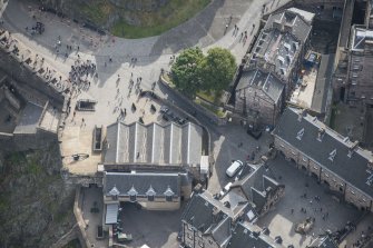 Oblique aerial view of Edinburgh Castle centred on Mills Mount,  looking SE.