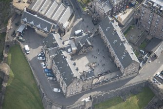 Oblique aerial view of Edinburgh Castle centred on the National War Museum of Scotland,  looking E.