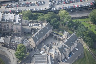 Oblique aerial view of Edinburgh Castle centred on the National War Musuem of Scotland,  looking S.
