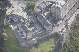 Oblique aerial view of Edinburgh Castle centred on the National War Museum of Scotland,  looking SE.