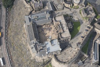 Oblique aerial view of Edinburgh Castle centred on the Palace Yard,  looking W.